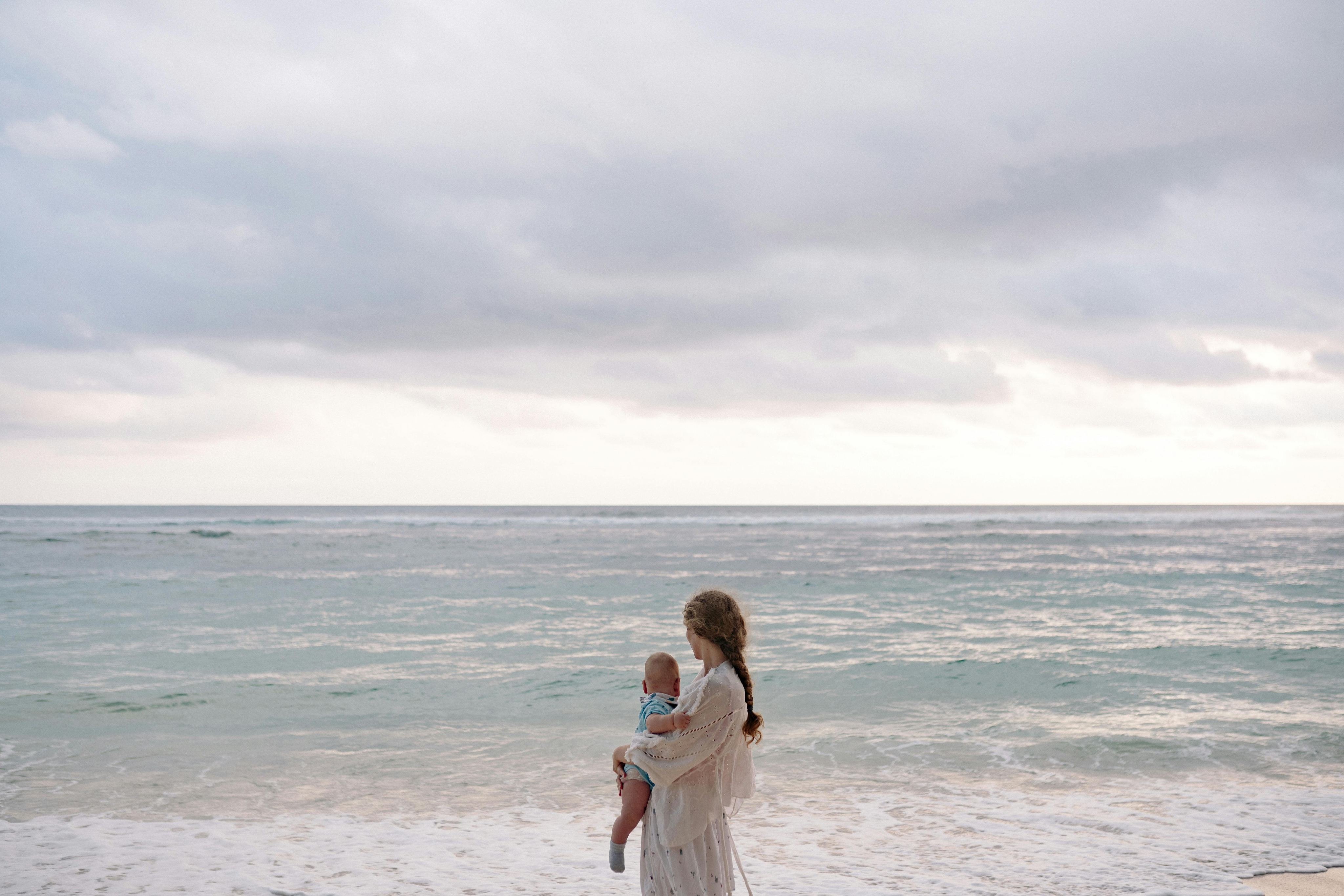 Mother with baby at beach