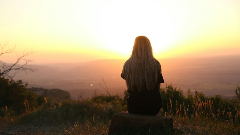 A woman looking at the sunset